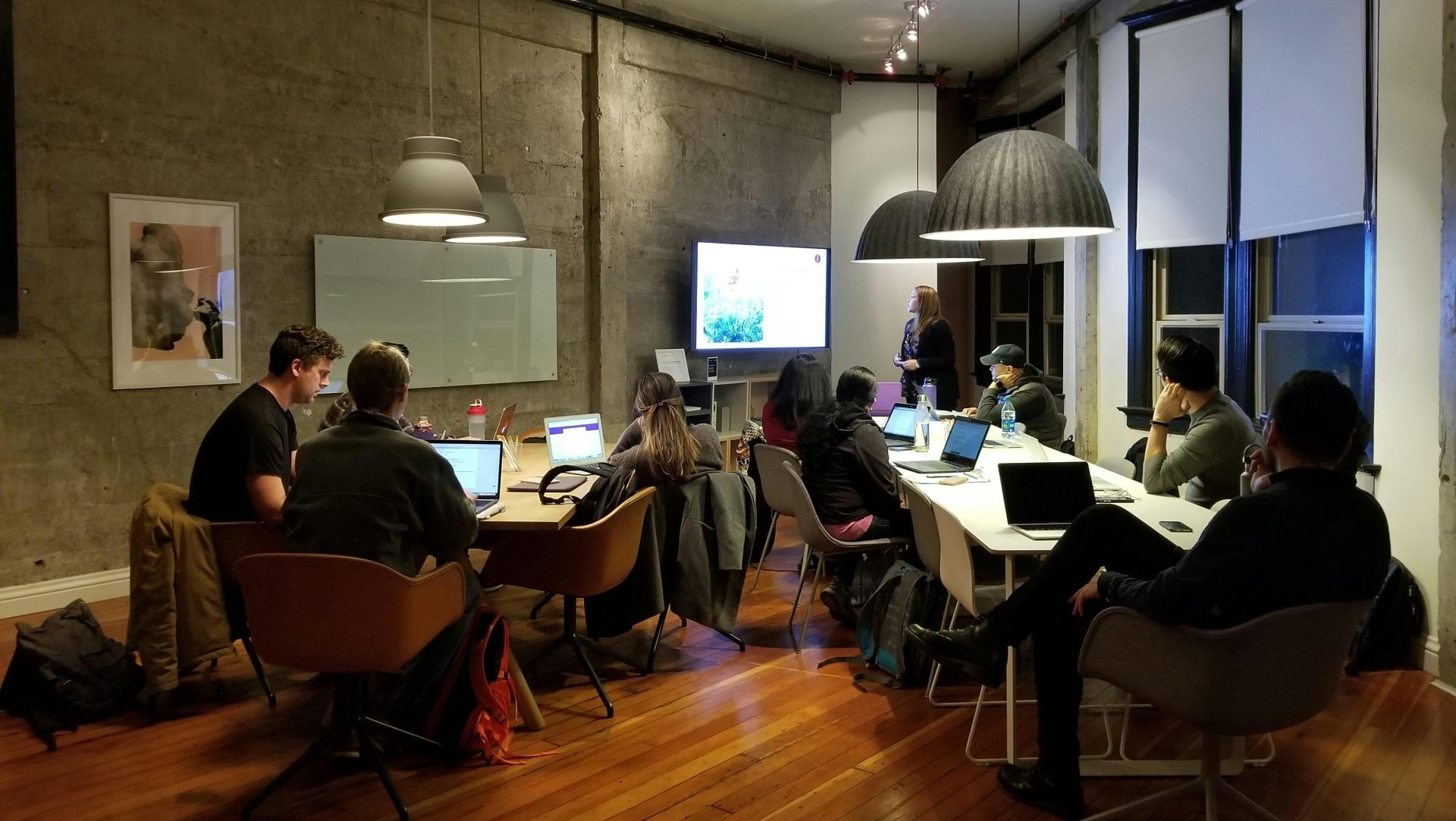 people sitting and using laptops
